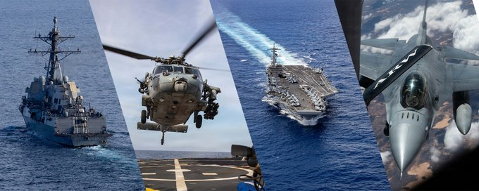 U.S. Navy Arleigh Burke-class destroyer escorting a merchant vessel in the Strait of Hormuz during Project Freedom.