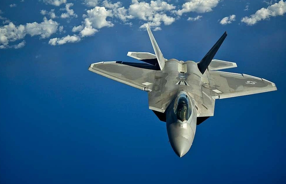 F-22 Raptor flying over ocean