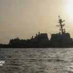 AEGIS-equipped guided missile destroyer conducting multinational naval operations with allied fleets in the Indo-Pacific region.