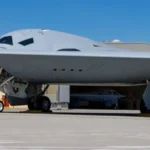 The Northrop Grumman B-21 Raider stealth bomber during a flight test maneuver.