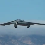 The Northrop Grumman B-21 Raider stealth bomber during a flight test maneuver.