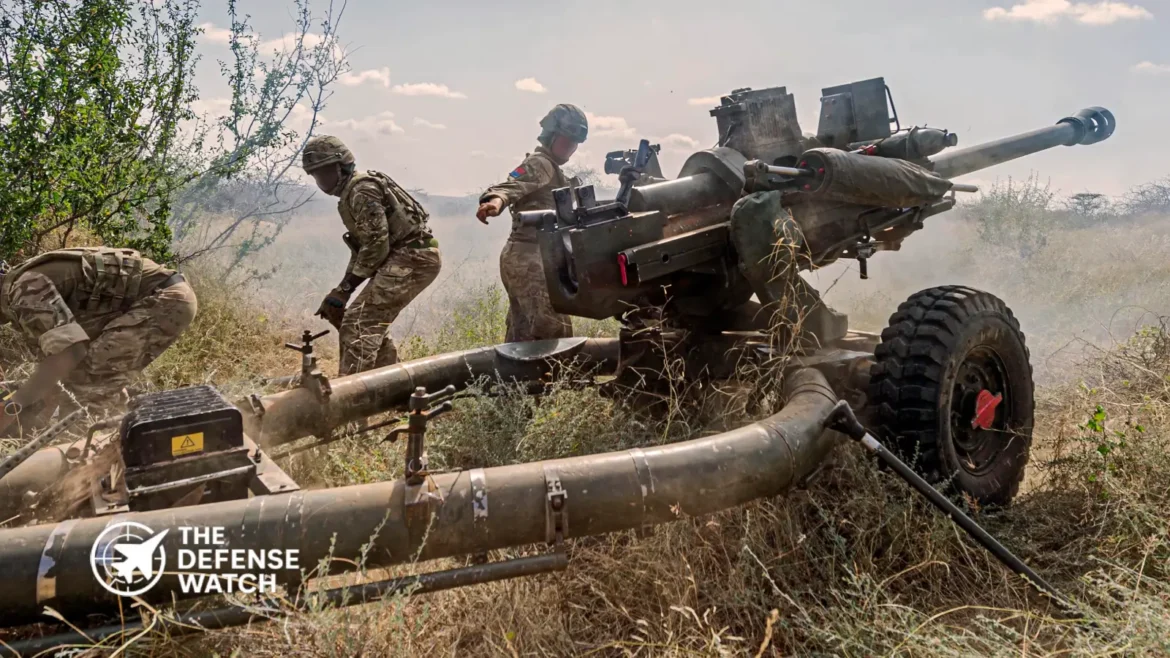 British Army soldiers operate a 105mm Light Gun during a live-fire artillery exercise in the United Kingdom.
