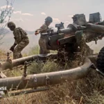 British Army soldiers operate a 105mm Light Gun during a live-fire artillery exercise in the United Kingdom.