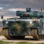 Polish Borsuk infantry fighting vehicles maneuver during a field exercise with ZSSW-30 remote weapon turrets and amphibious capability on display.