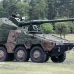 British Army RCH 155 wheeled artillery system mounted on Boxer armored vehicle during mobility and firing trials