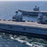 British aircraft carrier sailing in northern waters during NATO maritime operations near Norway