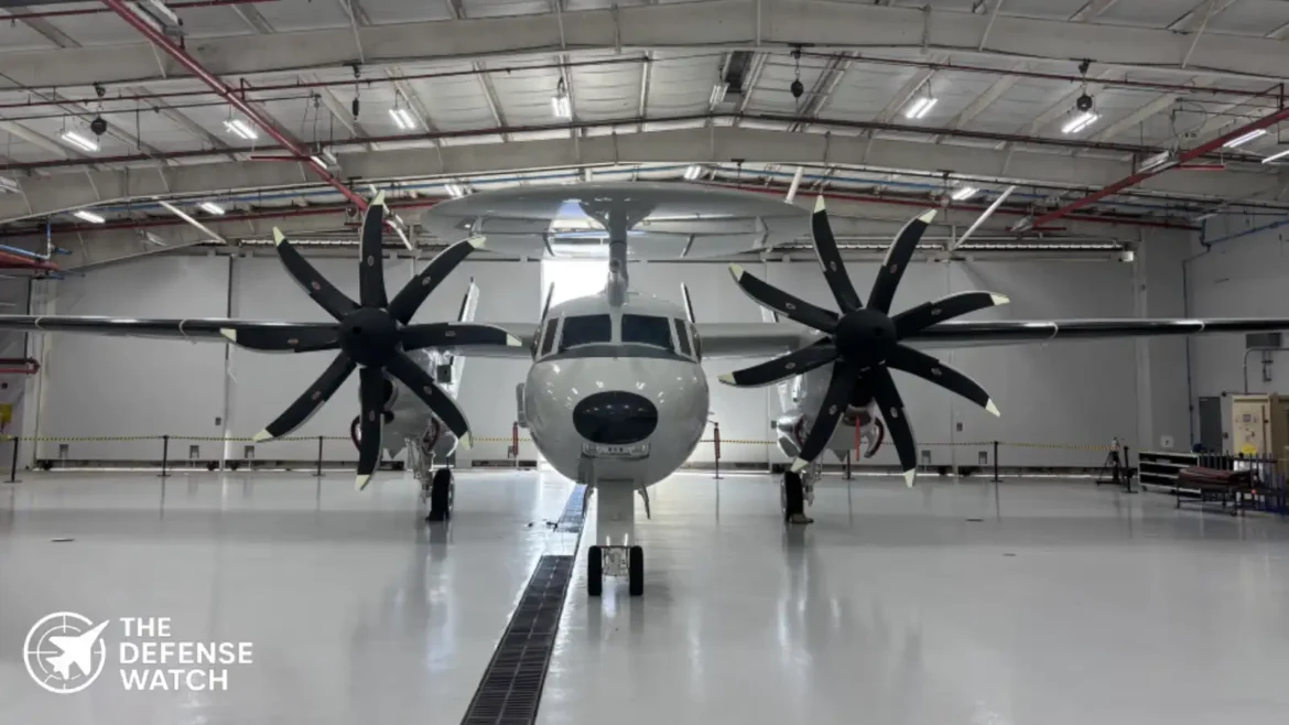 E-2D Hawkeye airborne early warning aircraft flying above U.S. Navy carrier