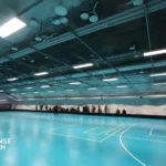 Helsinki's Itakeskus underground swimming hall — a dual-use civilian facility that converts into a bombproof shelter for 3,800 people within 72 hours, photographed March 2025.