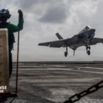 F-35C fighter jet undergoing carrier suitability testing with advanced flight instrumentation systems installed