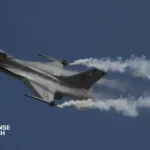 Pakistan Air Force F-16 fighter jet equipped with advanced avionics performing a high-G maneuver.
