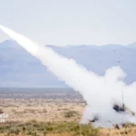 U.S. Patriot air defense system launching interceptor missile during live-fire exercise