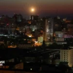 Ukrainian emergency crews respond to damage after Russian drone strikes hit residential buildings following the ceasefire expiration.
