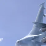 Russian military jet flying near a Royal Air Force surveillance aircraft during a NATO patrol mission over Europe.