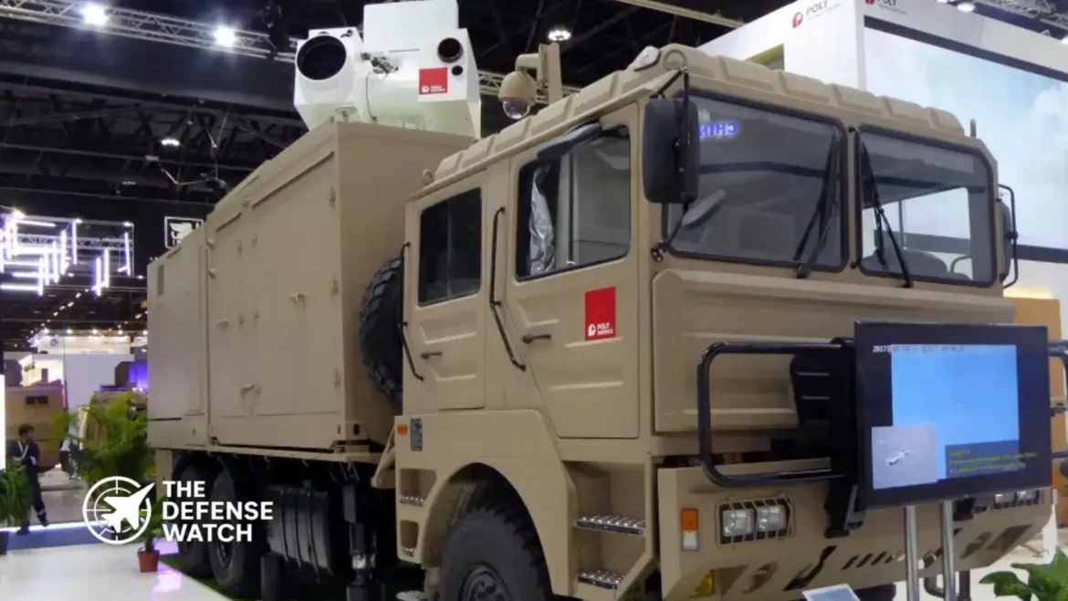 Chinese Silent Hunter mobile laser air defense system displayed or positioned near Abu Dhabi Airport facilities, highlighting its 6x6 truck-mounted configuration for rapid deployment.