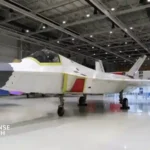 Spanish and Turkish flags alongside a KAAN stealth fighter aircraft during defense cooperation discussions