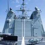 Spanish Navy vessel operating H135 helicopter and unmanned aerial systems during maritime combat network testing at sea