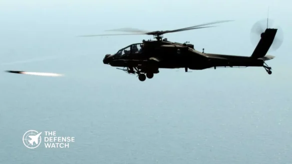 US Army AH-64E Apache and Navy MH-60R Seahawk flying in formation over the Persian Gulf.