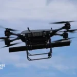 A TRV-150 tactical resupply drone hovering during a live-fire test while launching a 70 mm APKWS rocket at Fort Rucker, Alabama.