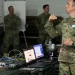 U.S. Navy cyber operations center with technicians managing secure network systems and infrastructure