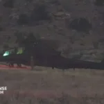 U.S. Army AH 64 Apache helicopter operating with ground combat forces during next generation battlefield network testing exercise