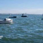 U.S. Navy unmanned maritime vessel operating during maritime surveillance and naval technology testing exercise
