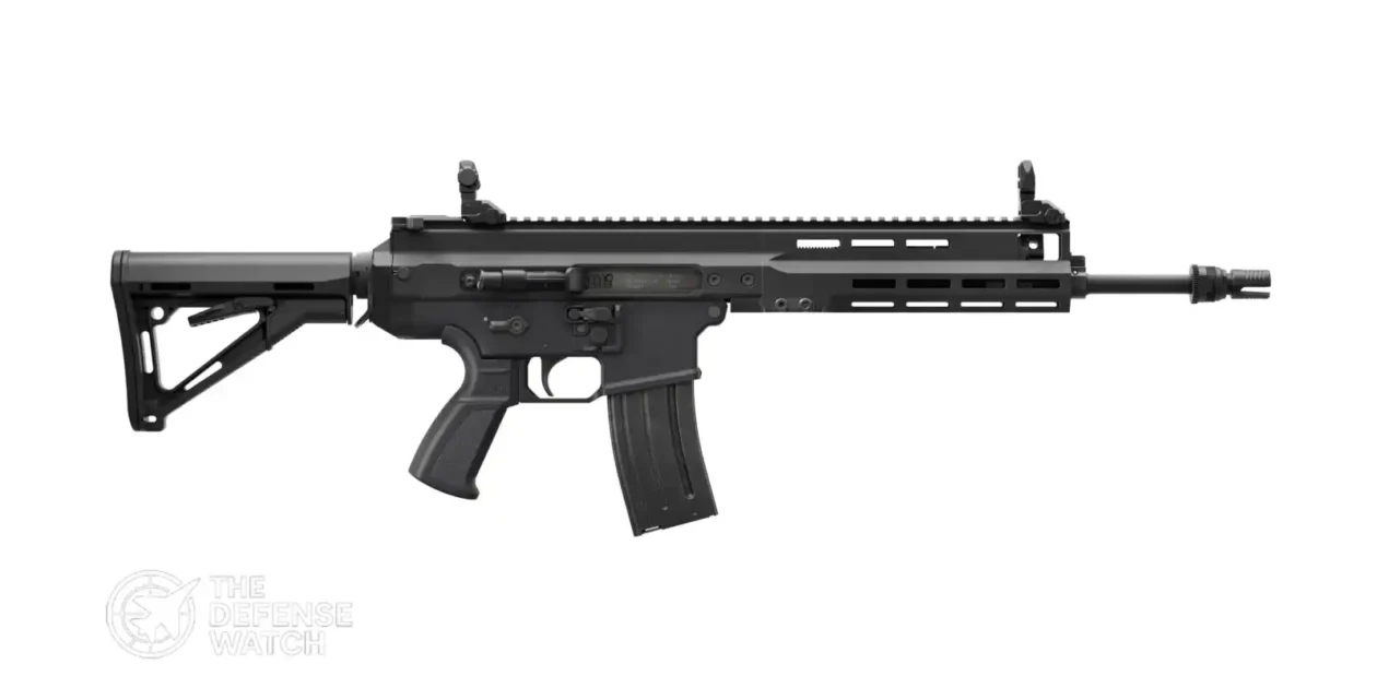 FN ARKA 5.56mm assault rifle displayed during a defense exhibition, highlighting its modern infantry weapon design and SCAR-derived architecture.