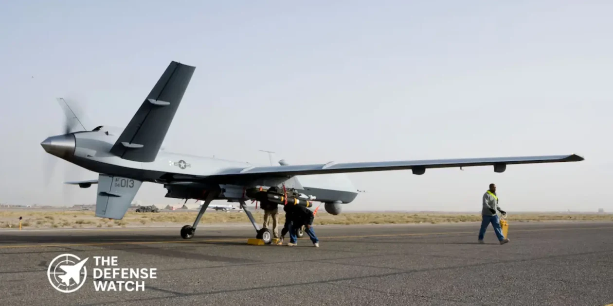 A General Atomics MQ-9 Reaper drone carrying AGM-114 Hellfire missiles on wing hardpoints during a combat air patrol mission.