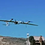 AeroVironment P550 long range reconnaissance drone conducting a tactical mission during a U.S. Army field exercise.