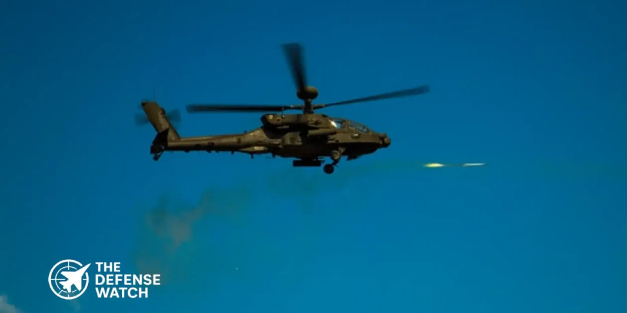 U.S. Army AH-64 Apache attack helicopter firing rockets during a live-fire training exercise near the Korean Demilitarized Zone.