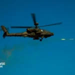U.S. Army AH-64 Apache attack helicopter firing rockets during a live-fire training exercise near the Korean Demilitarized Zone.