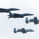 US Air Force F-15E fighter aircraft operating alongside NATO allies during a multinational air policing mission in Europe.