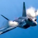 A U.S. Air Force F-22 Raptor performs a high-alpha maneuver during an aerial demonstration, showcasing its twin-engine thrust-vectoring capability and low-observable airframe design.