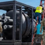 U.S. military personnel inspect a transportable nuclear microreactor designed to provide emergency power to military installations during grid outages.
