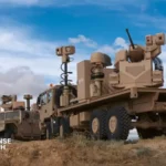EM&E Group's ODIN-I counter-UAS vehicle equipped with sensors, electronic warfare systems, and a 30 mm remote weapon station during field operations.